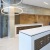 a well-lit mailroom with a big light fixture