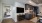 a kitchen with moveable island and tv