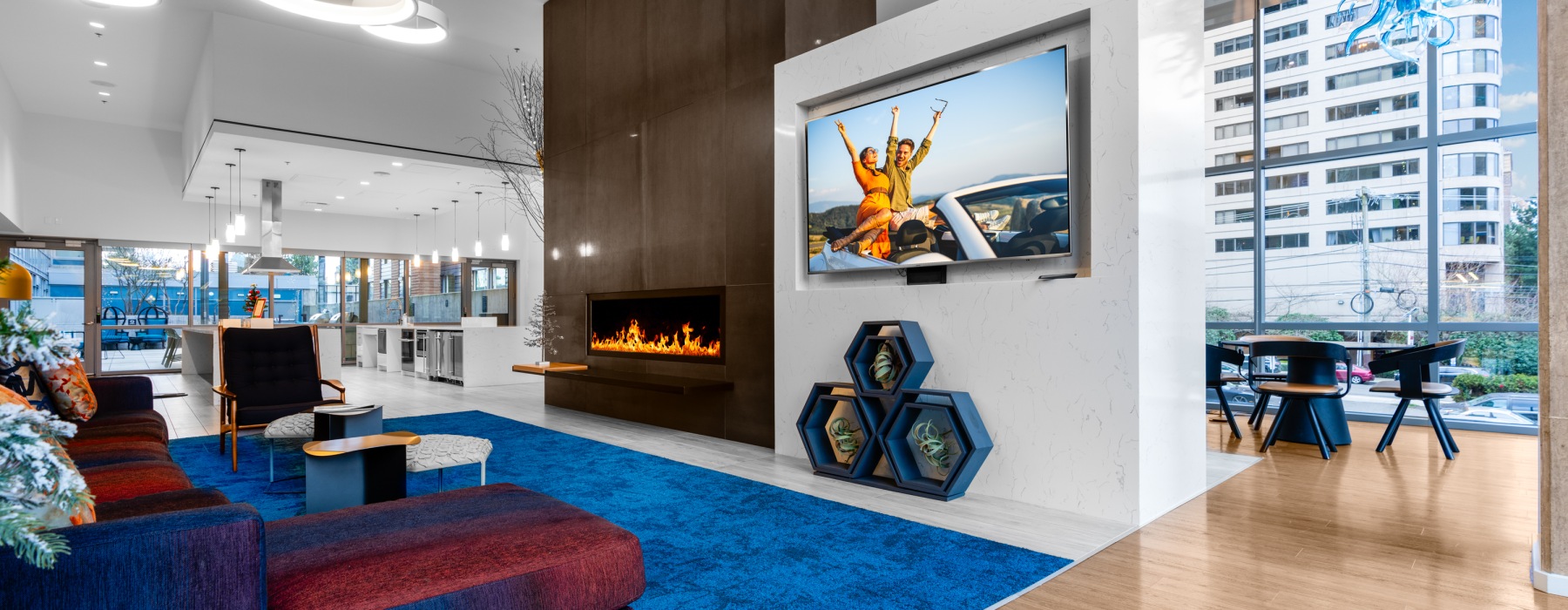 Resident Community room with tv and fireplace 