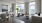 a living room with lots of large windows