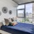 a blue bed in a well-lit room