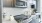 a kitchen with white countertops