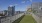 a rooftop fence and a city